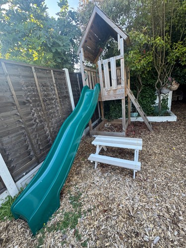 Climbing frame with slide